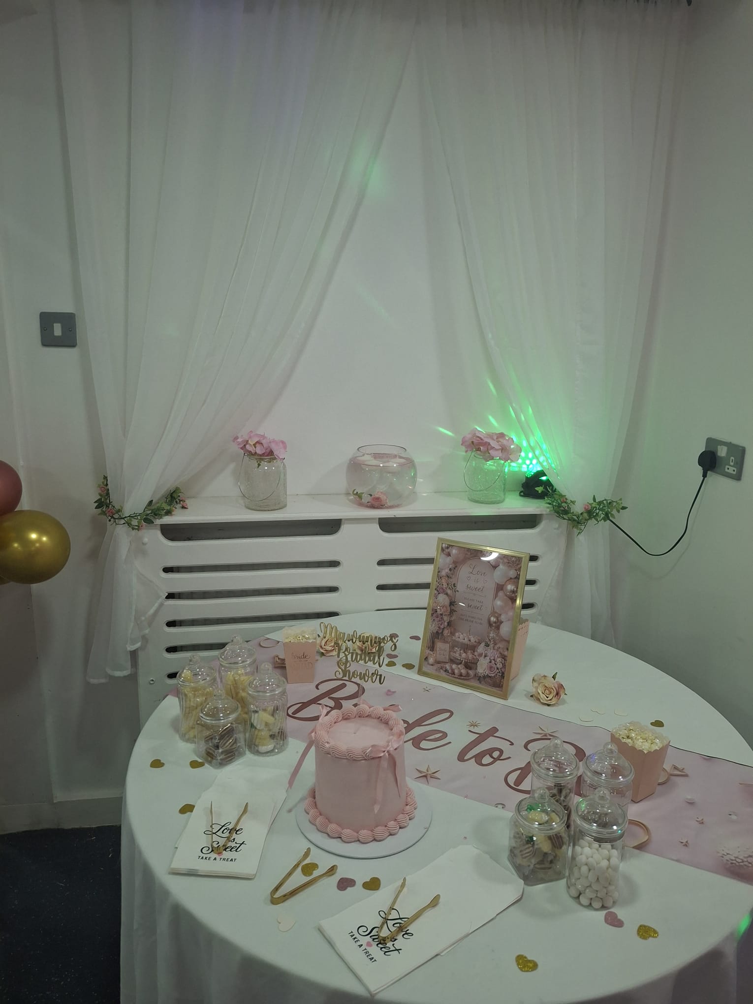 Pink bridal shower cake and sweets table