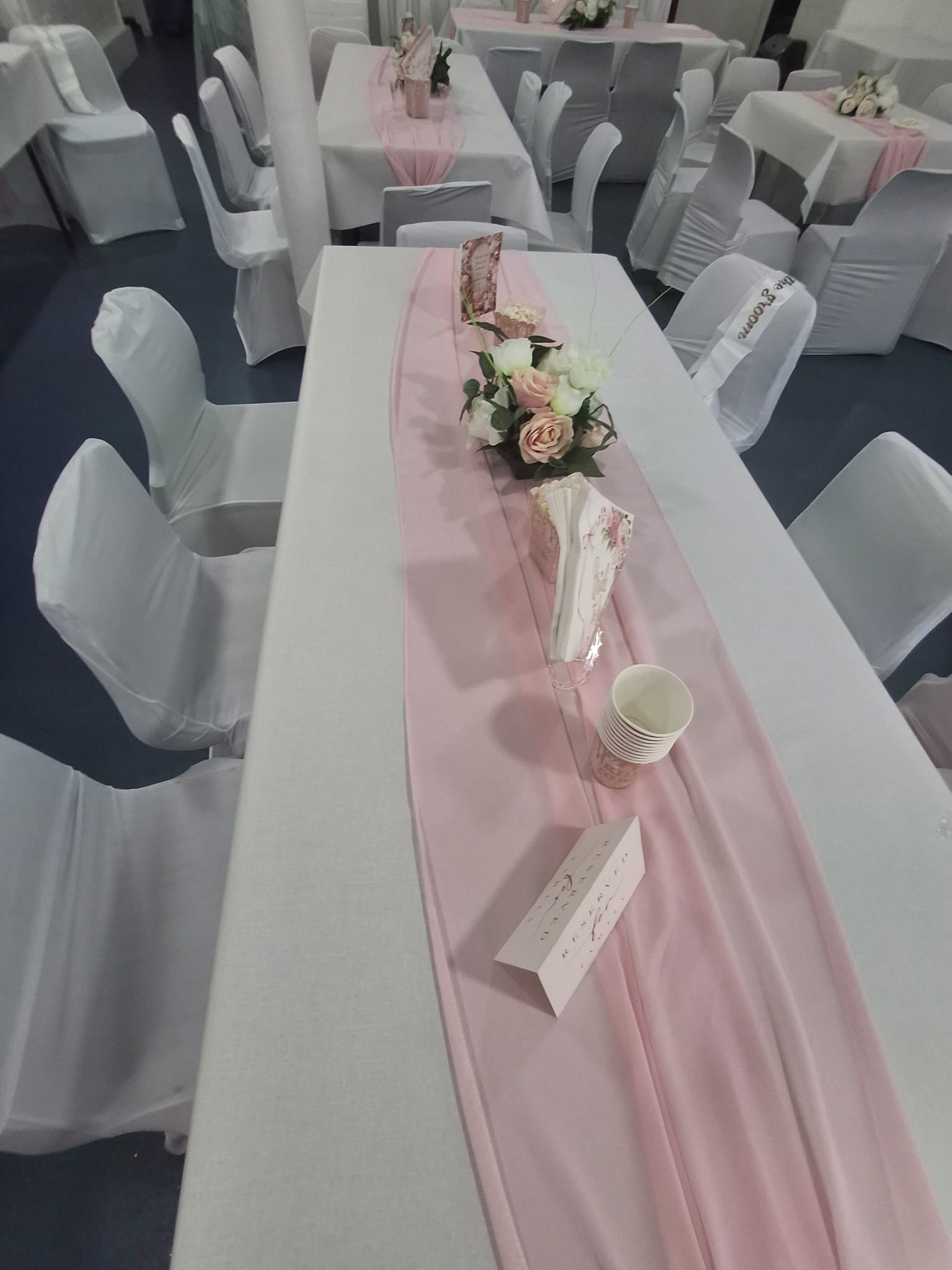 White and blush table setting with floral centrepiece